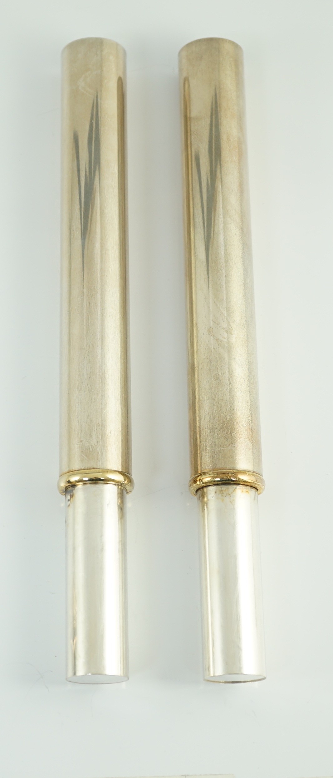 A modern pair of French parcel gilt 925 silver cylindrical flower holders, by Tabbah, Paris